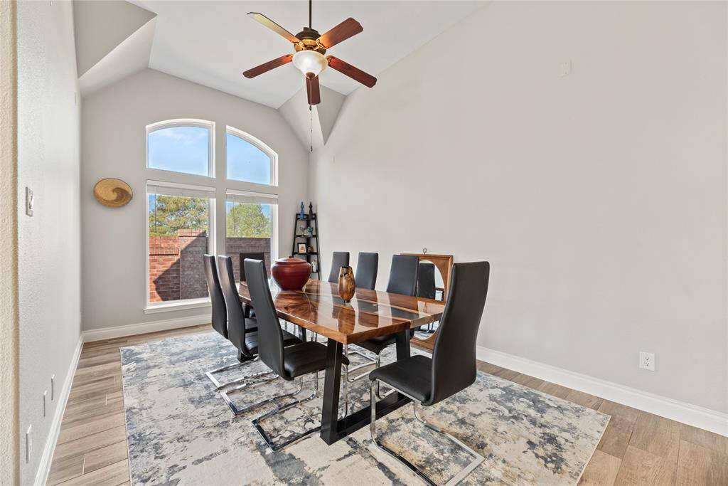 Continuing down the hallway we come to the formal dining room. Again, the oversized windows add elegance to this space.