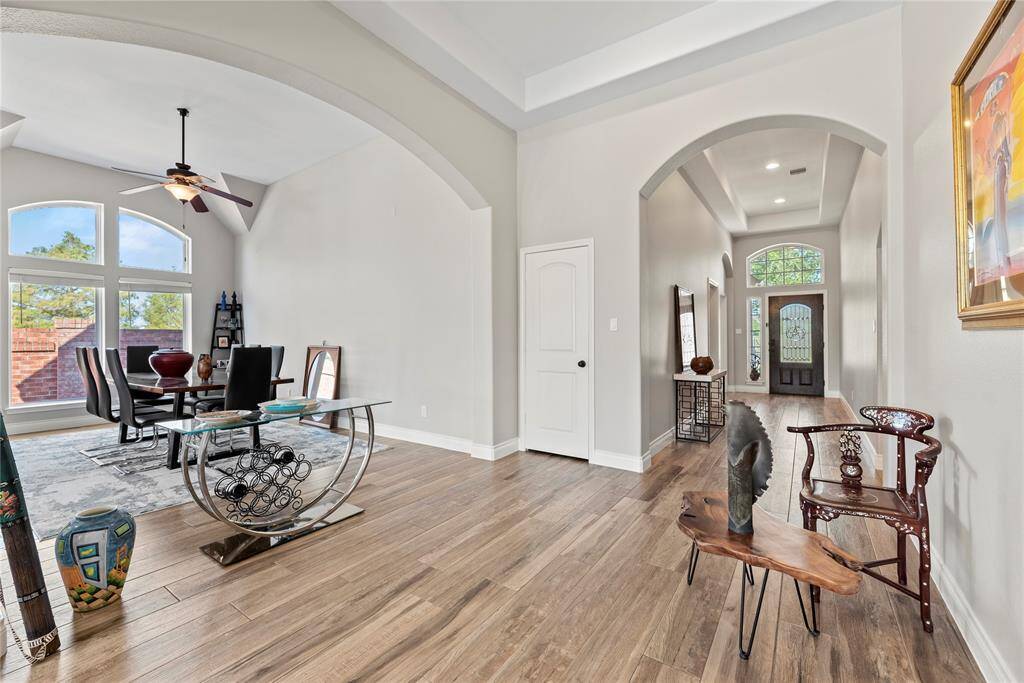 A good view of where the dining room fits into the house. Notice the upgraded wood-tile flooring that goes throughout the house.