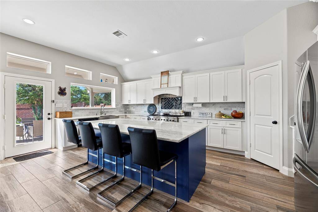 This space was updated head to toe: cabinets, counters, flooring, back splash, sink, cook top, counter tops. It's ready to go!