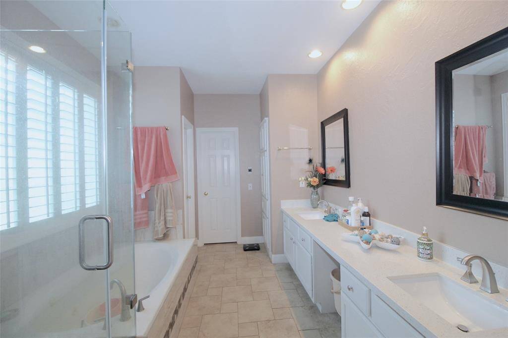 Primary bathroom also had dual vanities