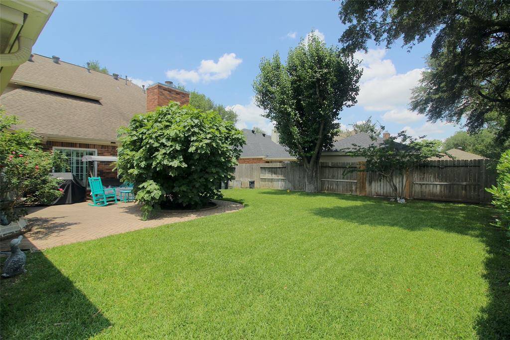 Fully fenced backyard view