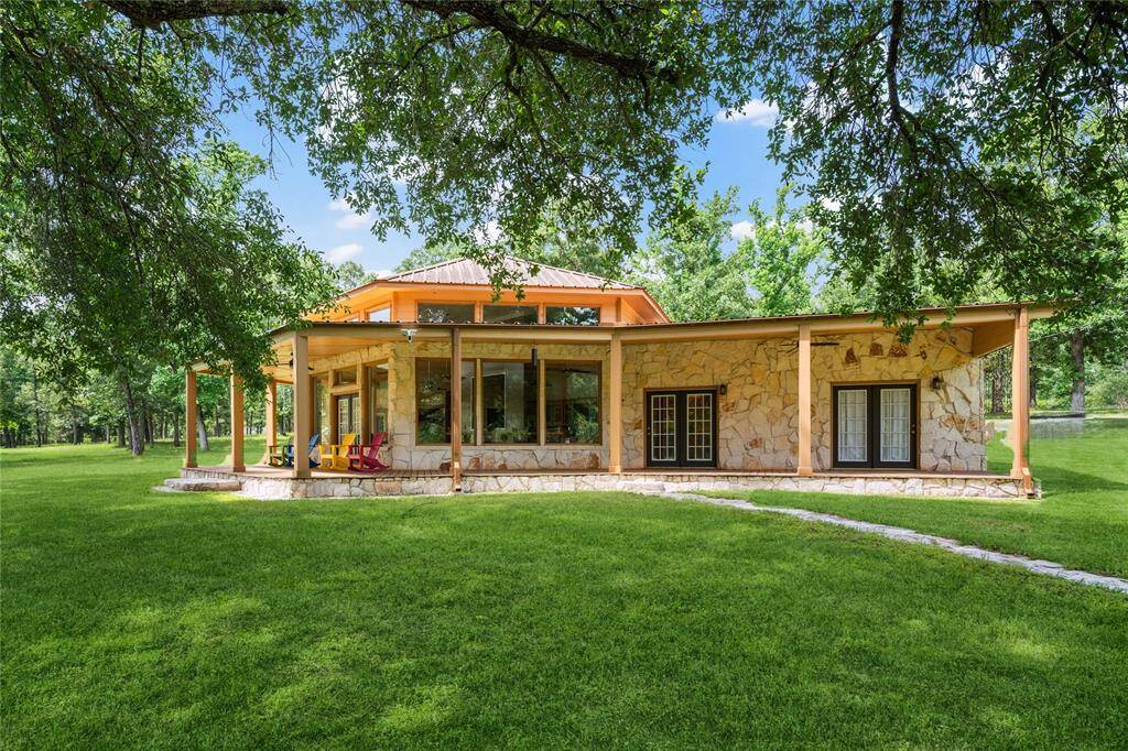 This home was built with the pond view in mind! Wrap around windows plus multiple entry access opportunities.