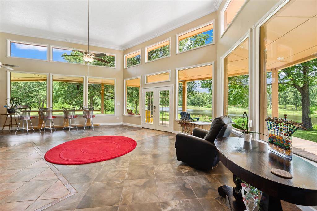 Very open floor plan! Family room and dining area both have fantastic views! Tile flooring throughout main area of home. Double French doors lead out to the covered porch.