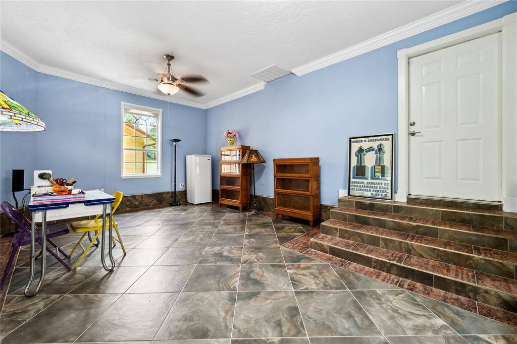 Bonus room is located behind the kitchen and those steps lead out to the garage! How is this space useful for you and your family? Convert to BR #3? Work out area? Game room? Man cave? Very versatile!
