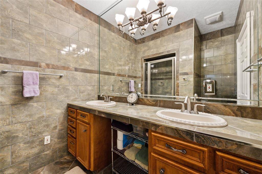 Owner's bath has double sinks and walk in shower.