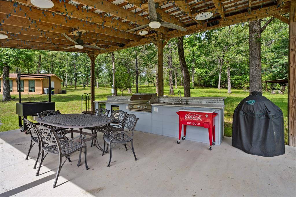 Covered outdoor kitchen area provides a great space for parties and special occasions! Invite everyone! You have tons of space!