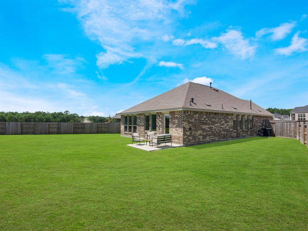 Charming brick home with a spacious, well-maintained backyard.