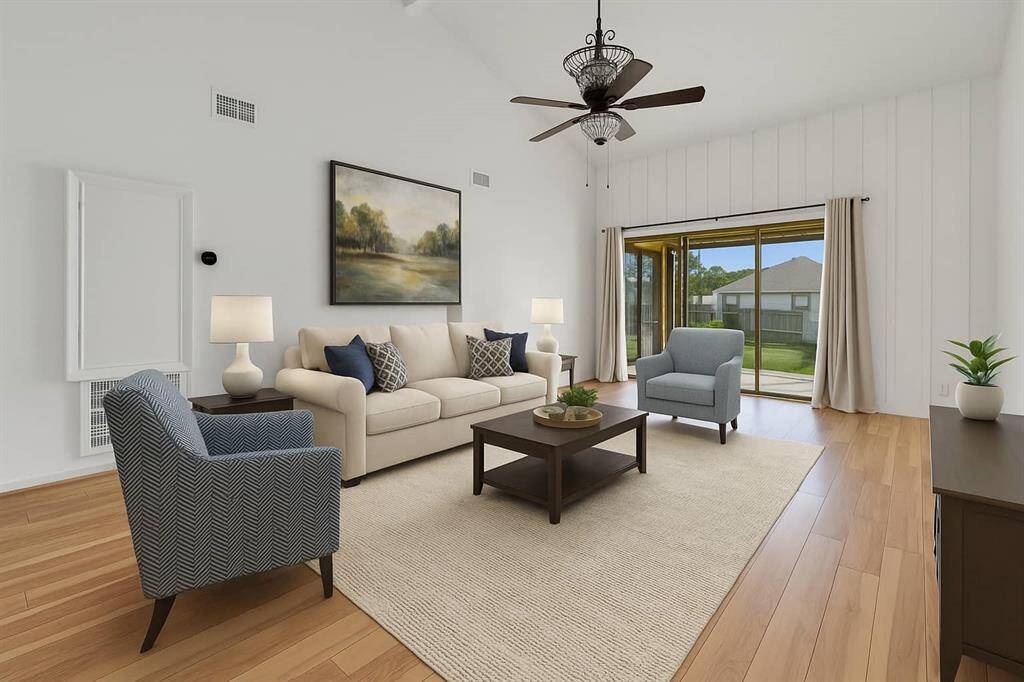 Bright, open living area featuring patio doors that showcase stunning lake views.