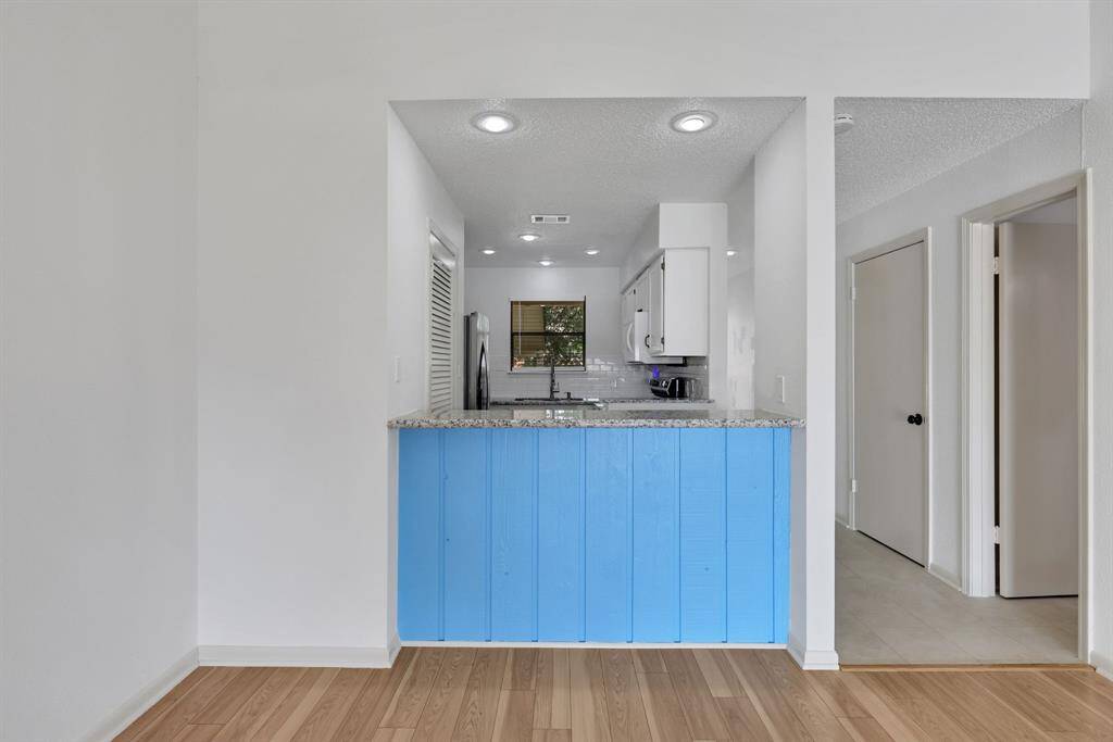 Breakfast bar adds functionality and style to the kitchen layout.