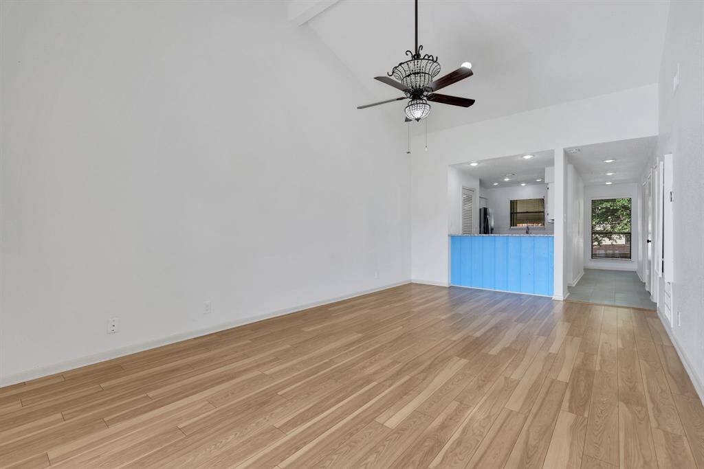 Bright, open living area featuring patio doors that showcase stunning lake views.