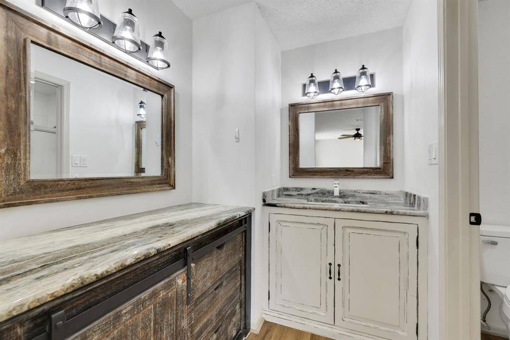 Updated and stylish primary bathroom with modern finishes.