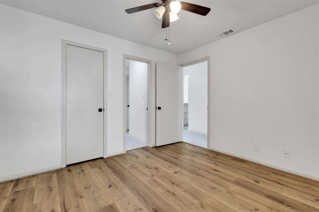 Secondary bedroom with convenient private access to the guest bath.