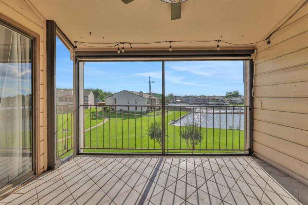 Enjoy your morning coffee with a serene view of Lake Conroe from your screened-in patio.