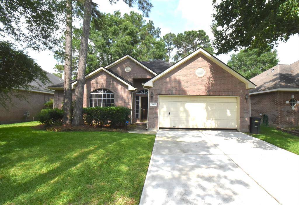 Charming brick home with a two-car garage and well-maintained front yard. Surrounded by mature trees, offering shade and privacy. Ideal for anyone seeking a cozy and inviting atmosphere.