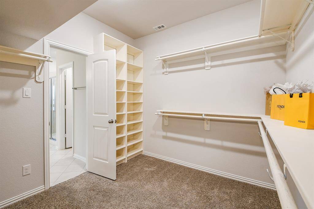 UPGRADED CUSTOM CLOSET LARGE WALK-IN-CLOSET IS READY FOR A FASHIONISTA!! UPGRADED CLOSET ORGANIZATION WITH A SHOE RACK