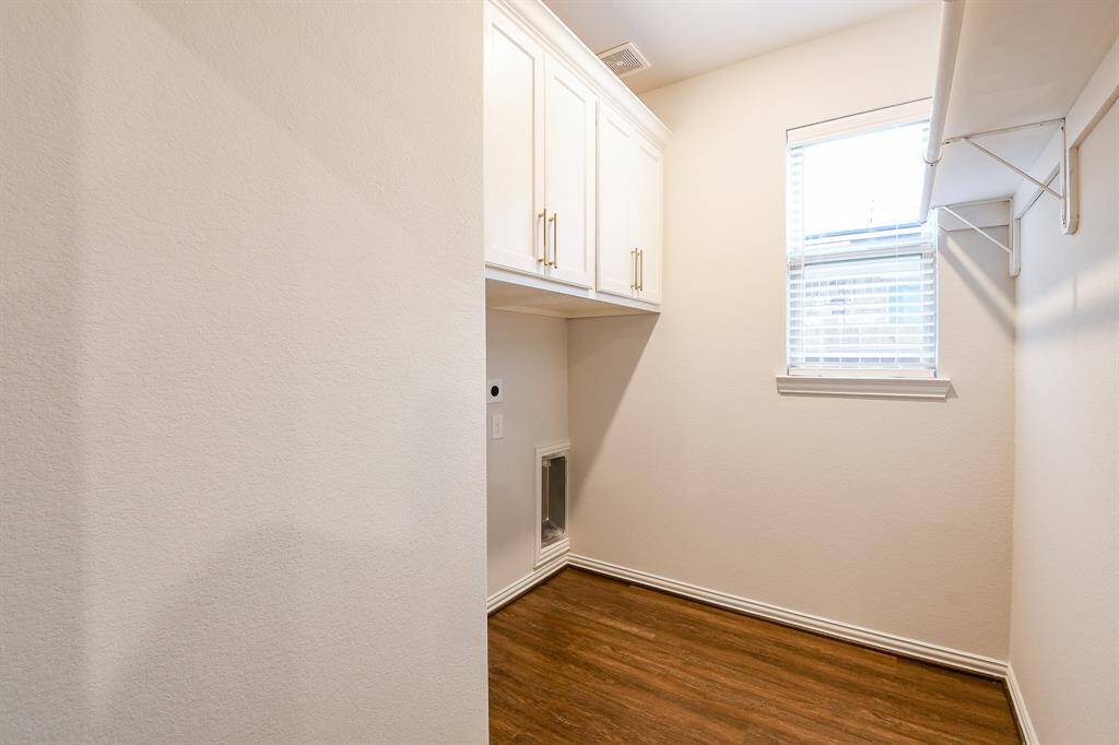 LAUNDRY IS LOCATED ACROSS FROM THE STAIRCASE ON THE 1ST FLOOR BY THE KITCHEN