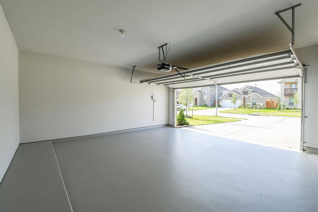 PRESTINE GARAGE WITH FRESHLY PAINTED FLOORING