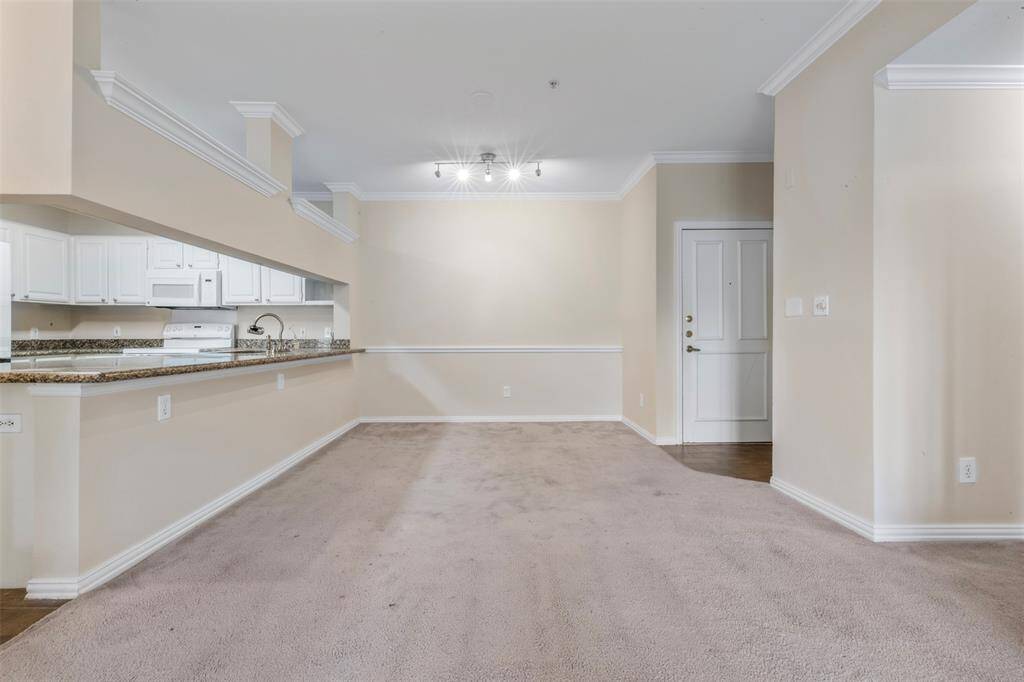 Dining room and kitchen with large counter space and island