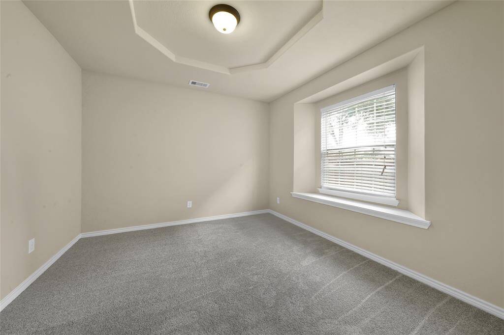 This room is connected to the primary closet.  Could be used as additioinal closet, office, nursery, or flex room