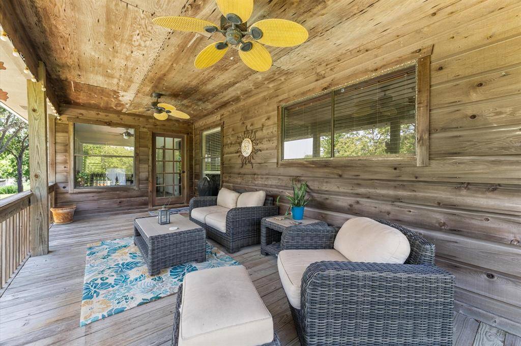 Large 2nd story covered porch. great for relaxing while looking out over the pool