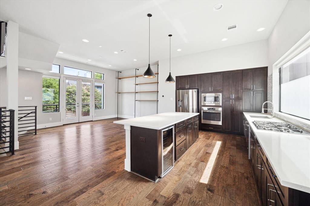 A designated dining area sits between a stunning contemporary kitchen and an oversized balcony - A perfect space for entertaining!!