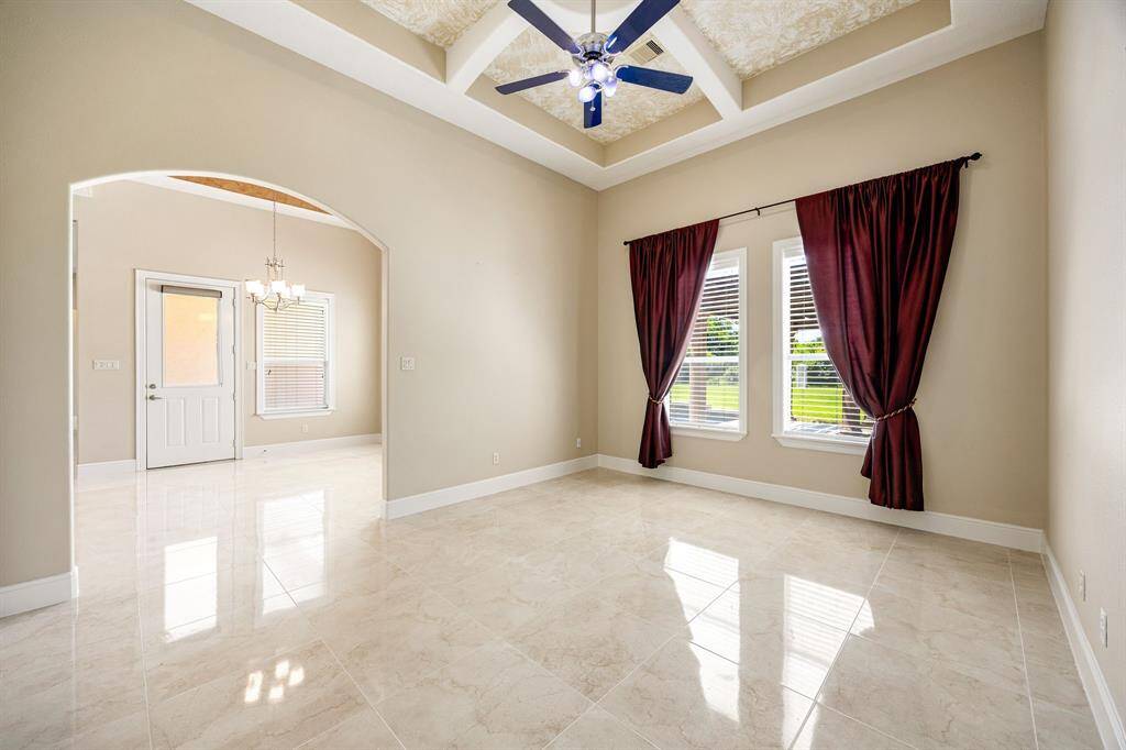 Formal den area can be used for whatever you desire. Perfect spot for a pool table, additional office, or even another formal sitting area.