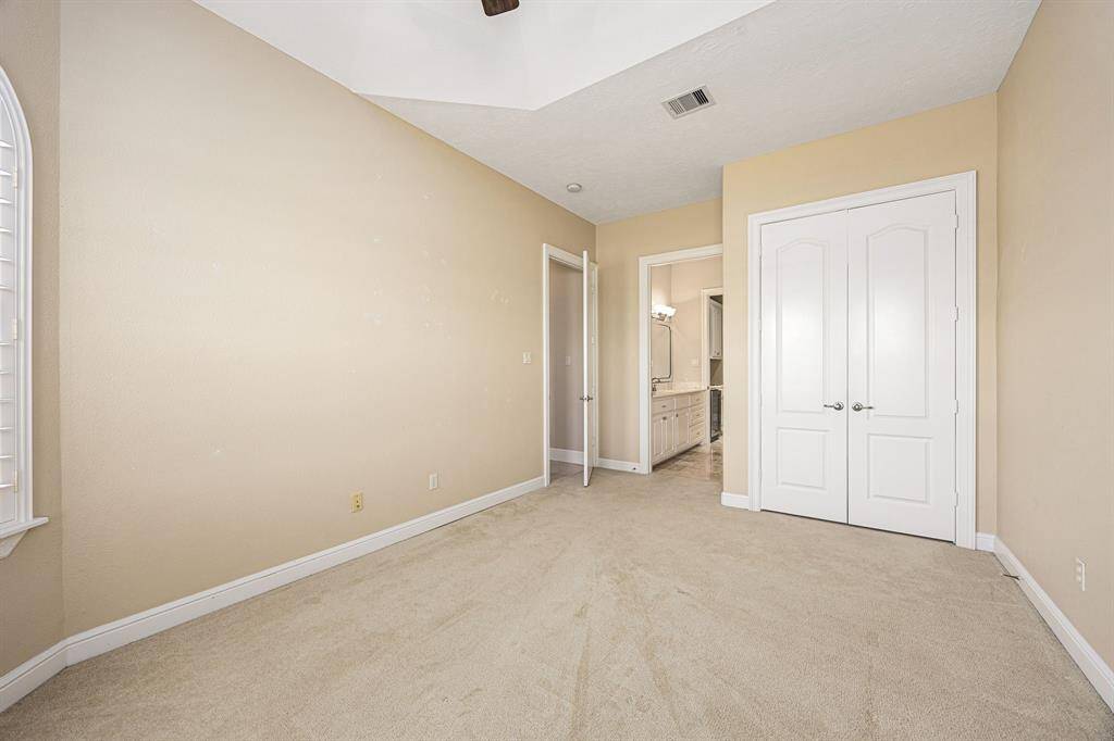 This secondary bedroom is located at the front of the house and can be accessed through the hallway near garage and laundry or through the side front entrance.