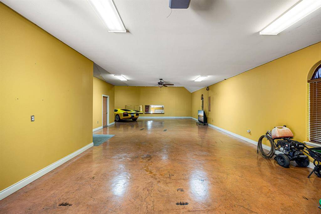 Inside, you'll discover a finished garage with climate control for year-round comfort and convenience.