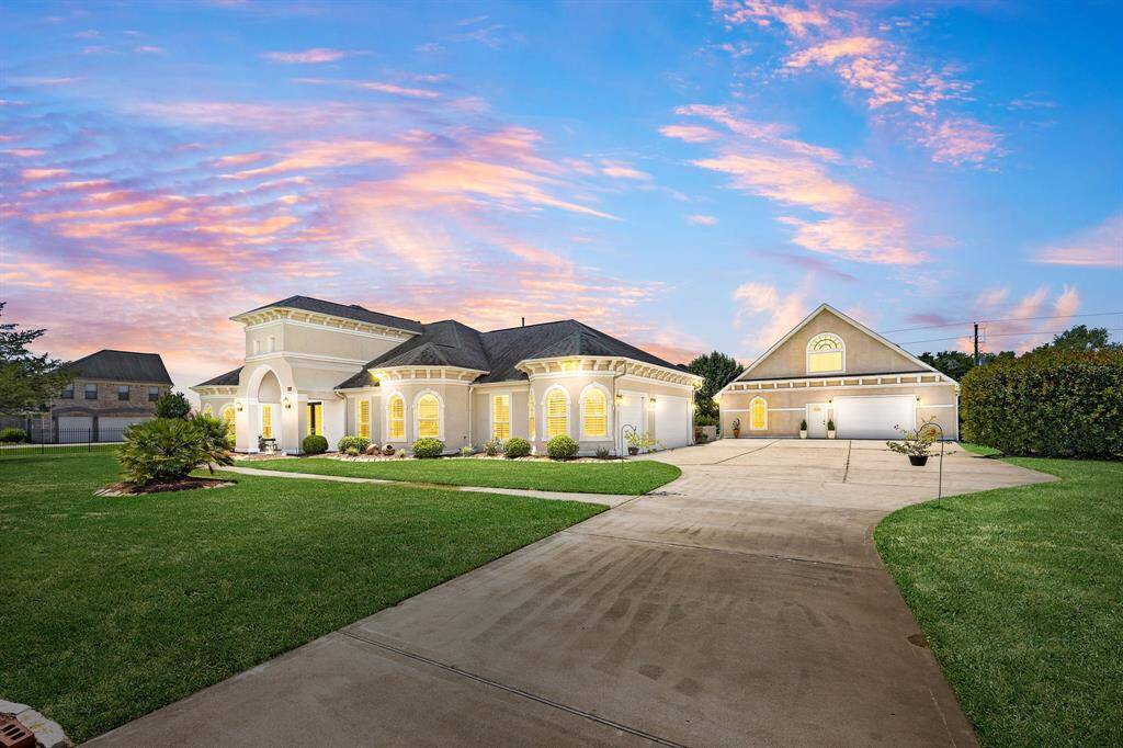 An extended driveway and a spacious detached garage—separate from the attached garage—provide endless possibilities.