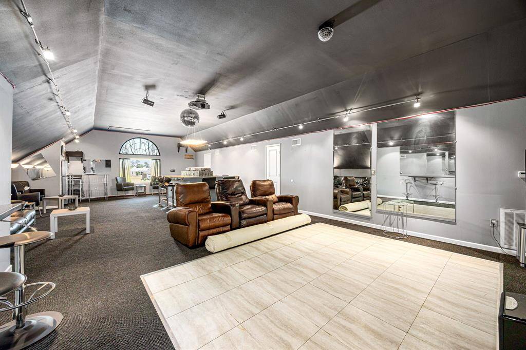Large space has plenty of seating areas for intimate conversations, a dance floor, an island buffet area, and a small kitchen.