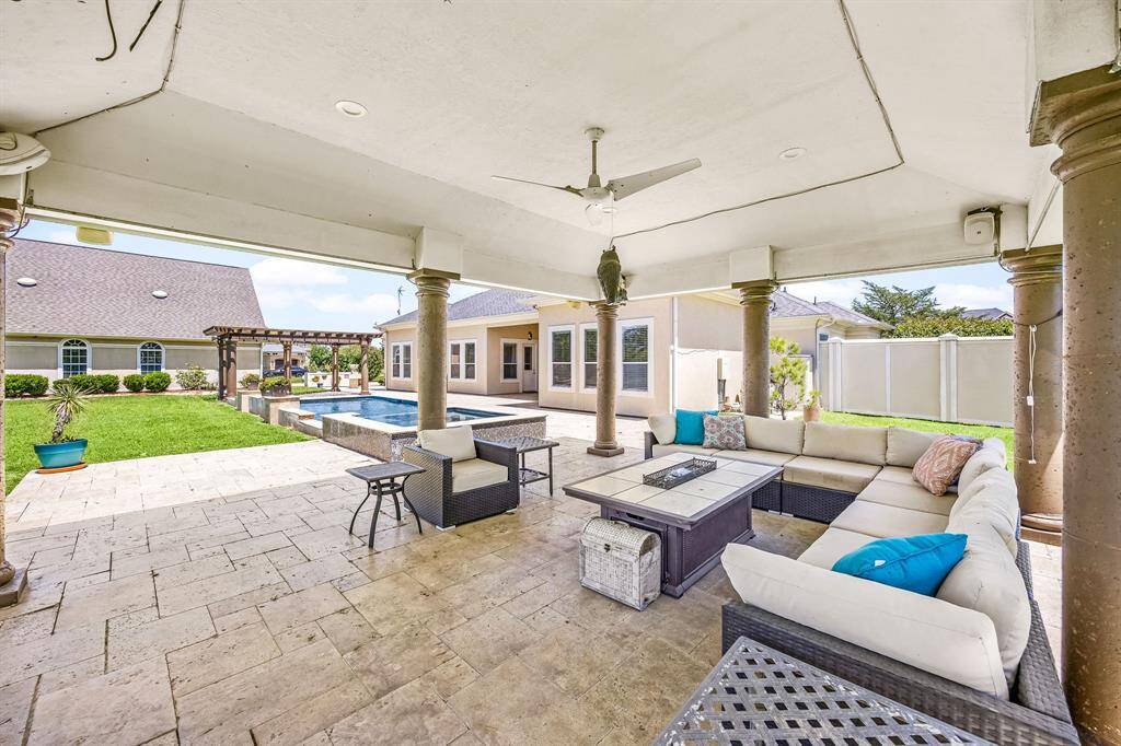 Covered patio easily accommodates large patio furniture. This set can convey with the home.