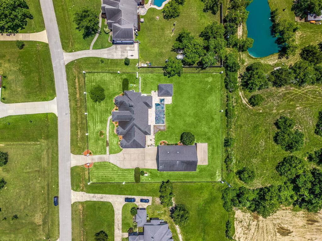 Tucked away at the back of the property you have a covered storage for your RV. Extended concrete driveway allows for ample parking for all your needs.