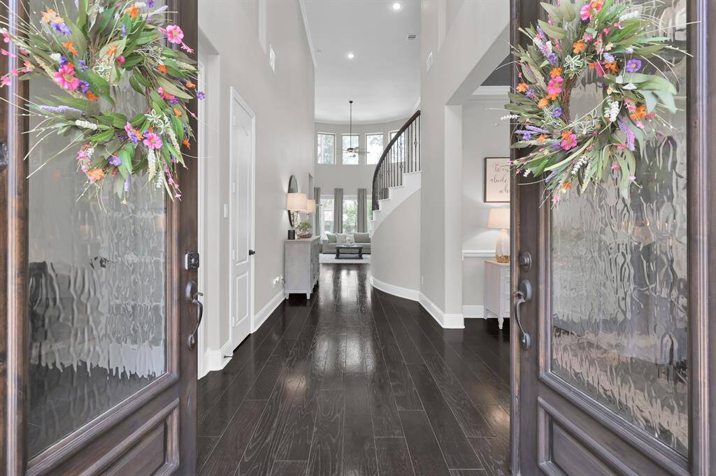 Welcome Home to 2122 Barton Woods Blvd and this stunning stone and stucco home.