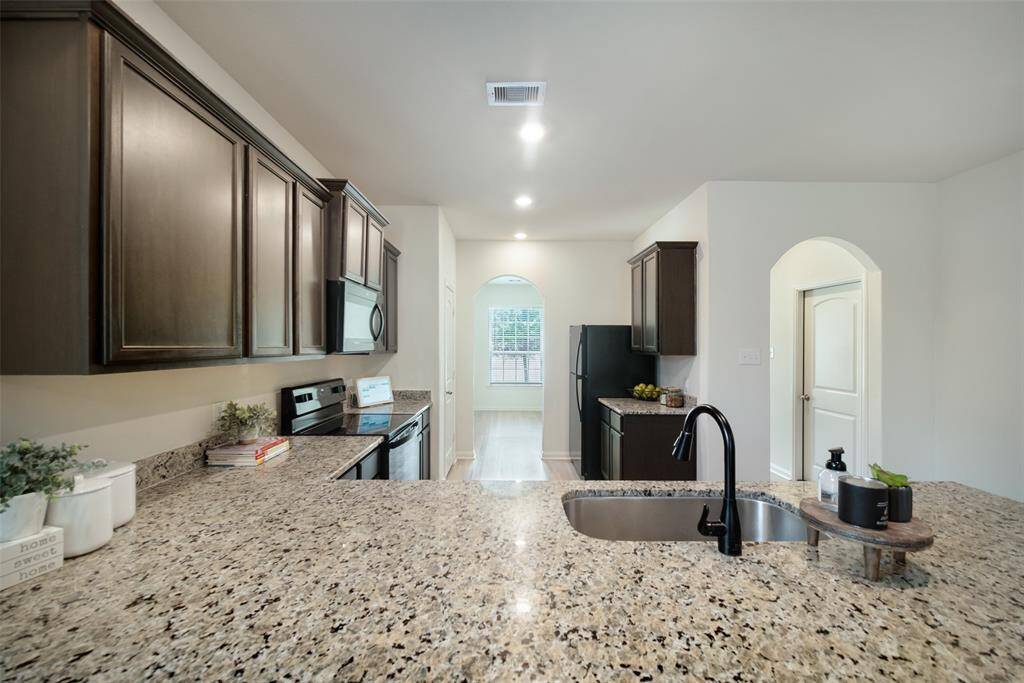 Another view of the kitchen showing that it connects to the dining room.