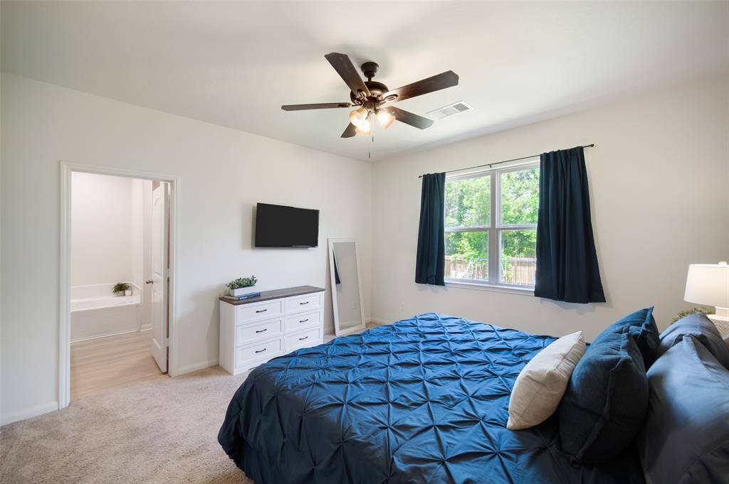 The door straight ahead leads to the attached primary bathroom with large walk-in closet.
