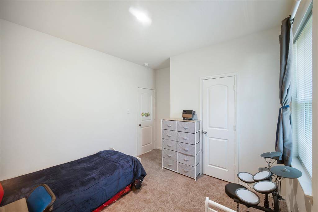 Straight ahead is the closet location in this 3rd of 3 bedrooms.