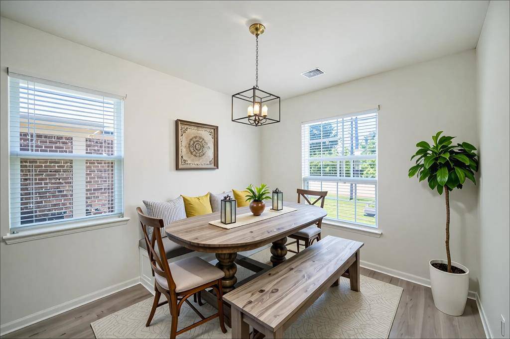 On the right as you enter the home is this cozy dining room that is perfect for entertaining. The room here is virtually staged, including the chandelier, to give an idea of the room's potential.