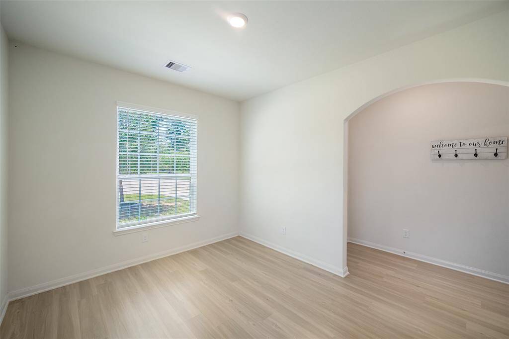 Here is the view from the dining room showing the front window and adjacent foyer.