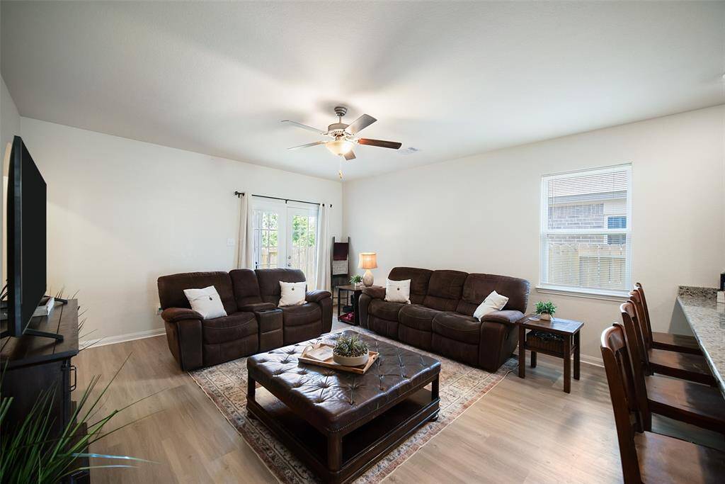 Step into the light and bright family room and you will appreciate the neutral paint.  The LVP floor is an upgrade added by the sellers.
