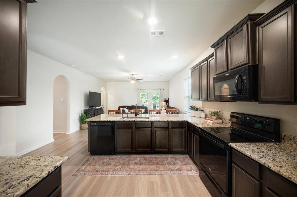 The kitchen is well-designed, with ample cabinets for storage and yards of counter space.