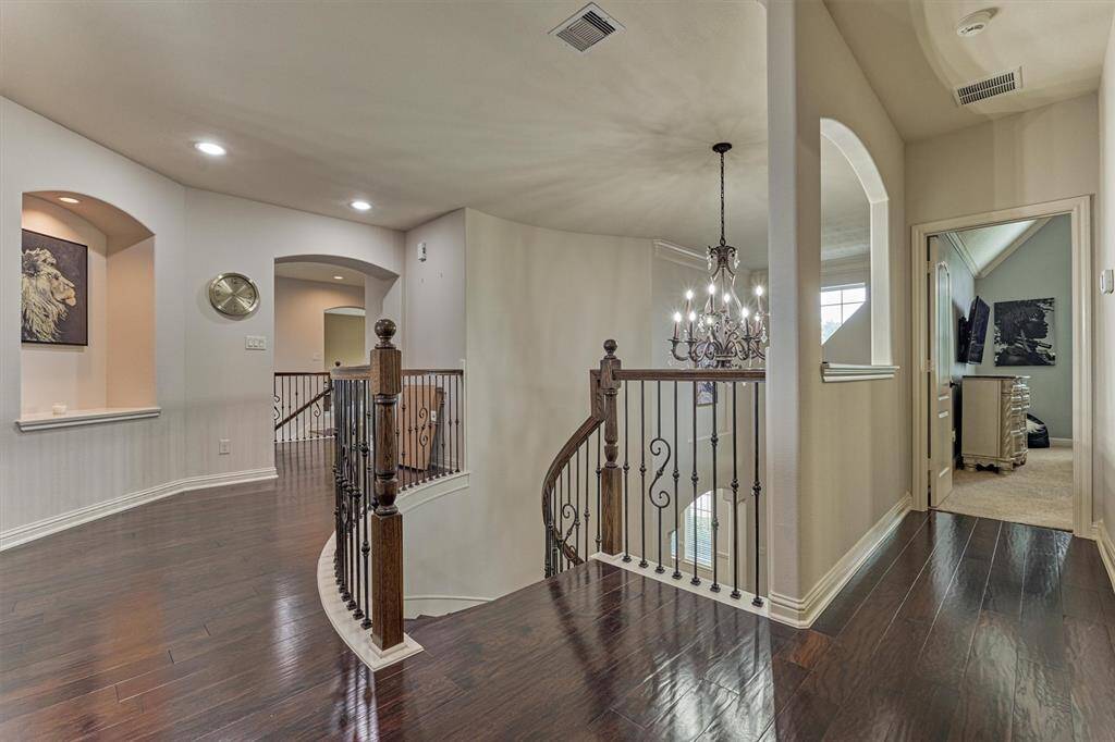 Two different sets of stairs lead you upstairs where you’ll find 4 additional spare bedrooms, large game room plus a theatre.