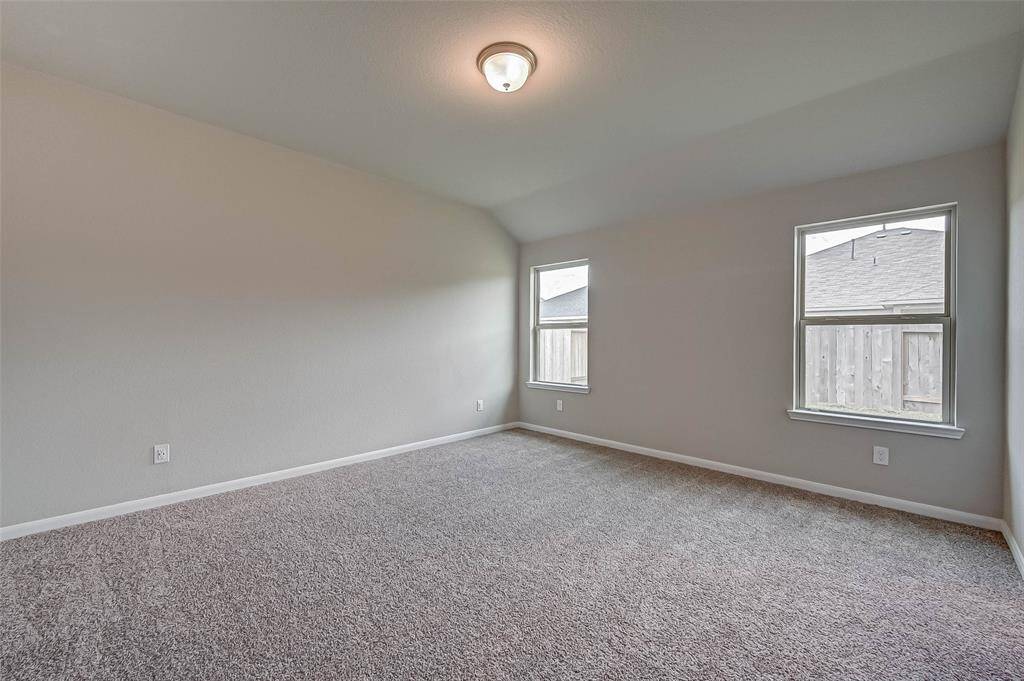 The primary bedroom features a walk-in closet and a private ensuite bathroom