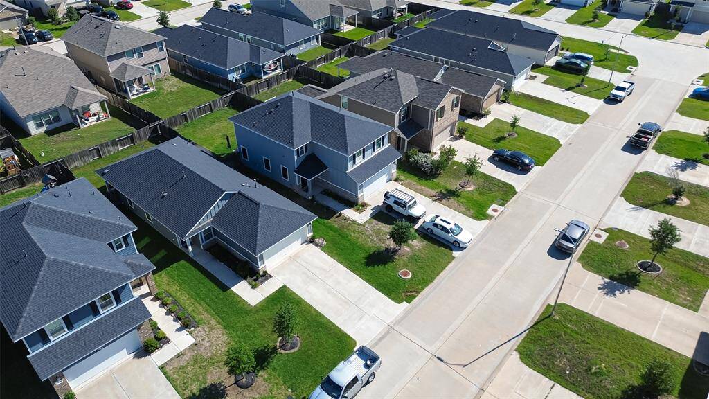 An extended driveway offers ample parking for guests or family.