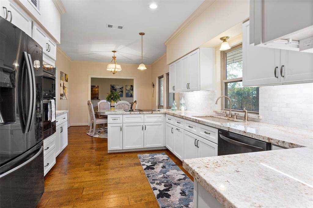 The peninsula adds extra counter space and a view to the family room...