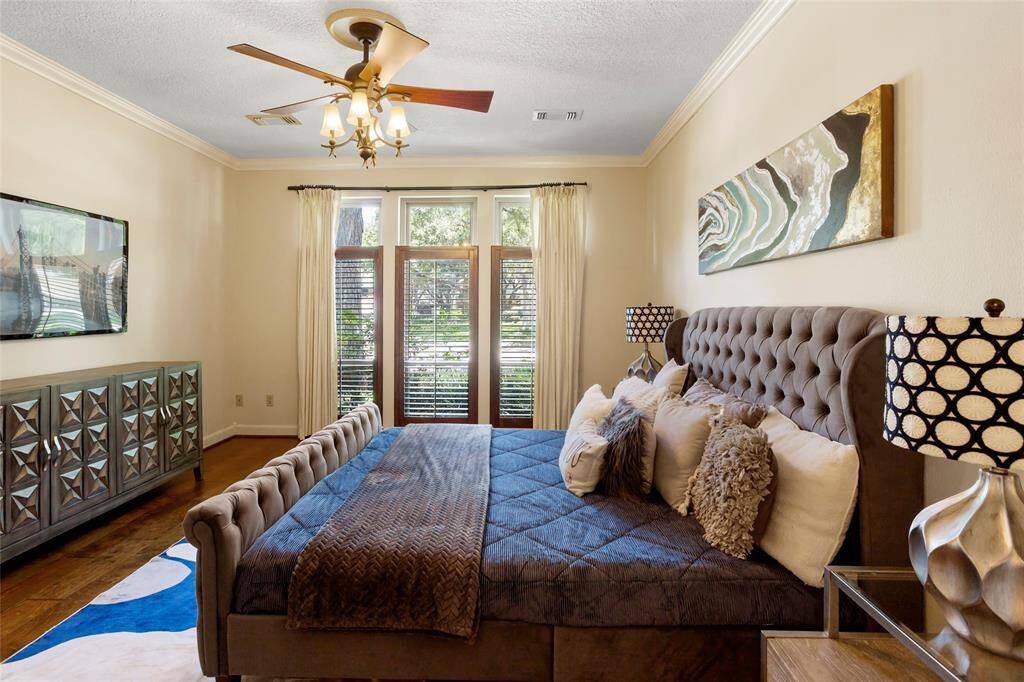 Primary is spacious with plantation shutters.