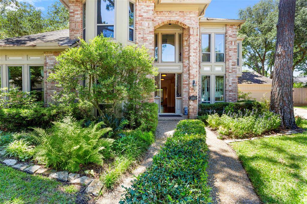 Greeted by lush landscaping upon entry...
