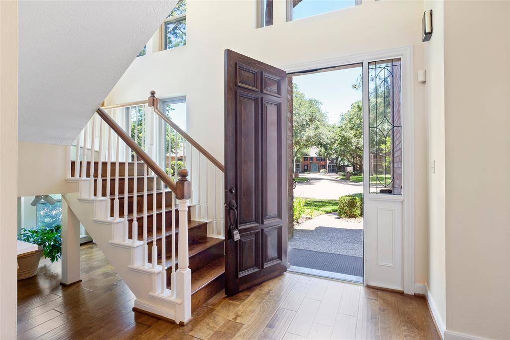 Formal foyer with grand staircase...