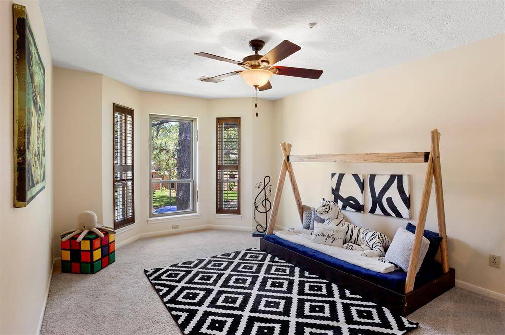 Bedroom #2 is bright with planation shutters.