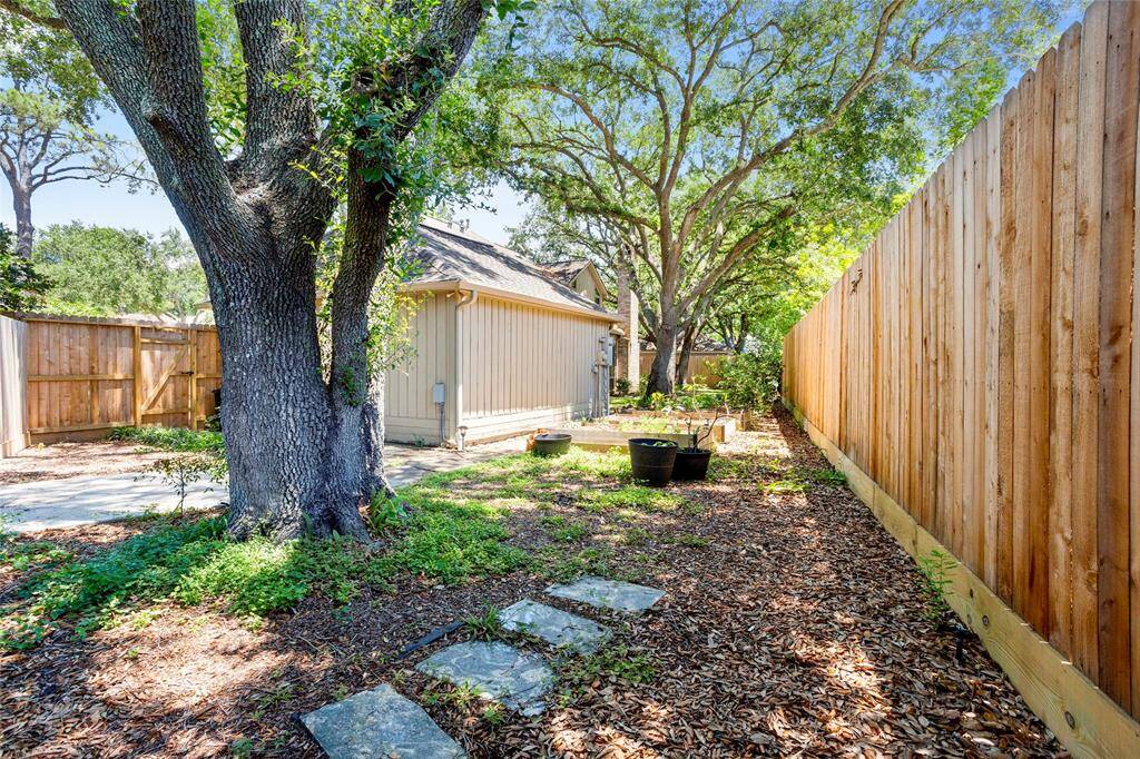 More landscaping behind the garage.