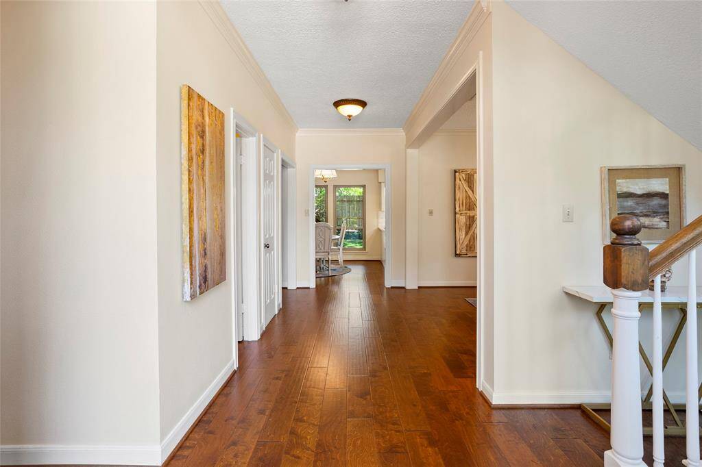 As you enter, formal dining room is on the right and guest half bathroom is on the left.